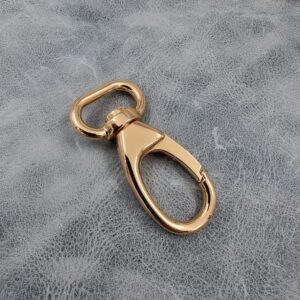 20mm Gilt Dog Clip, with 360 degree, oval swivel base. Suitable for a sling or dog leash.